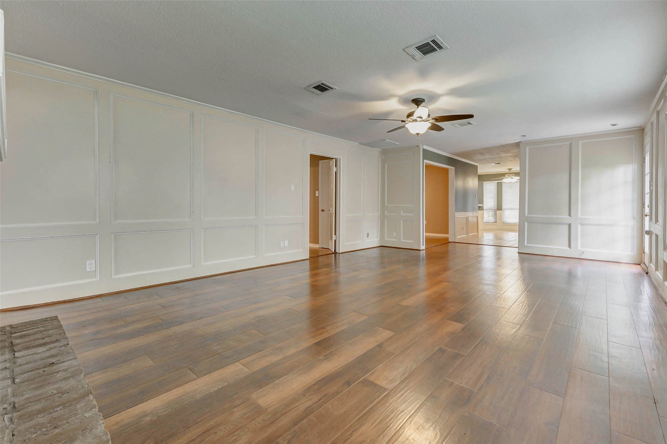 18103 Ravenfield Drive Houston, TX 77084 - Photo 11 of 36 wooden floor in an empty room with a window