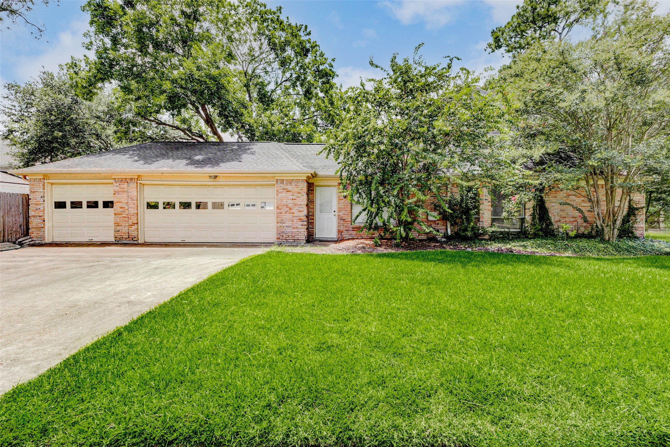18103 Ravenfield Drive Houston, TX 77084 - Photo 23 of 36 a front view of a house with a garden