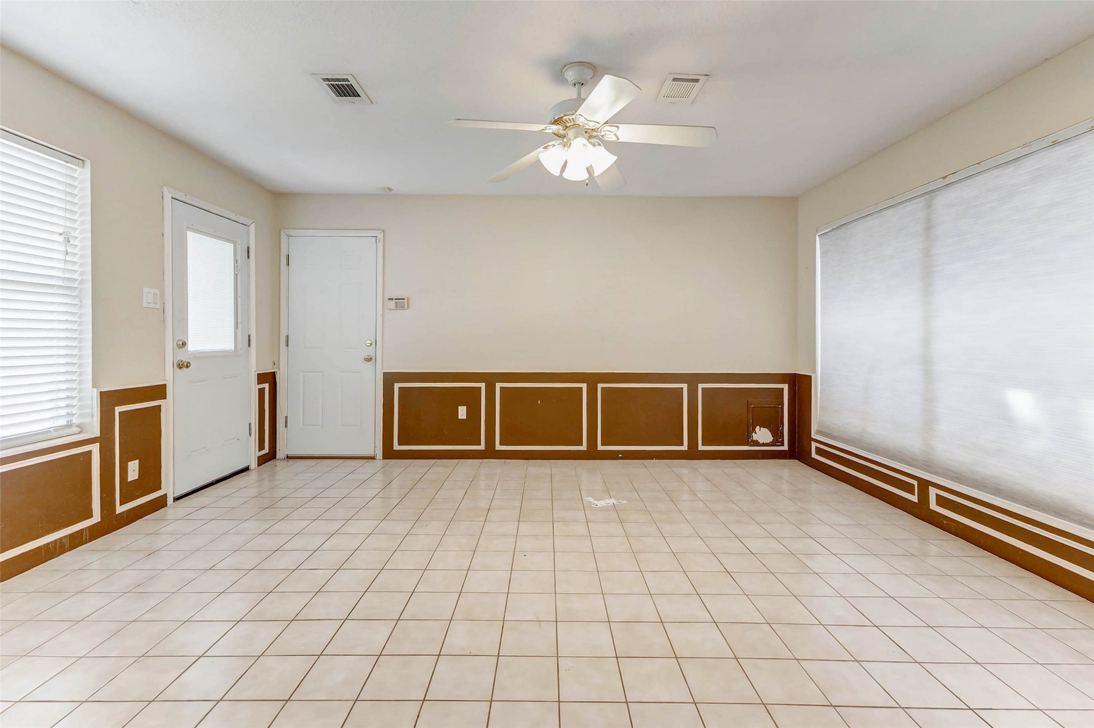 18103 Ravenfield Drive Houston, TX 77084 - Photo 27 of 36 an empty room with windows