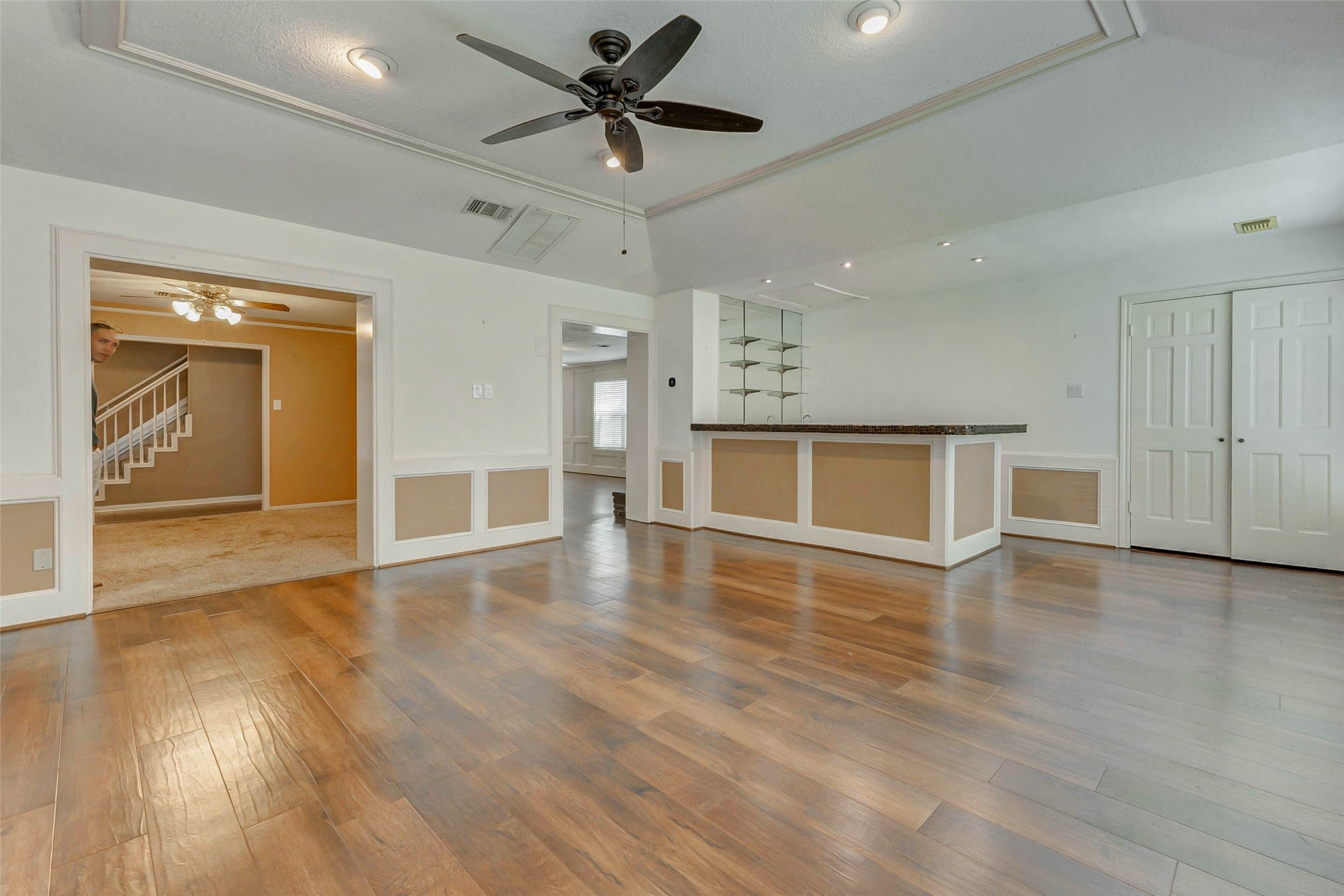 18103 Ravenfield Drive Houston, TX 77084 - Photo 9 of 36 a view of empty room with wooden floor and fan
