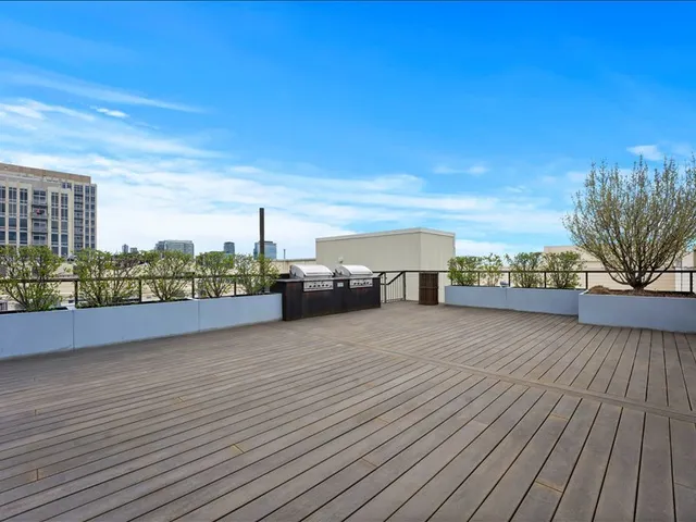 a view of a building with wooden fence