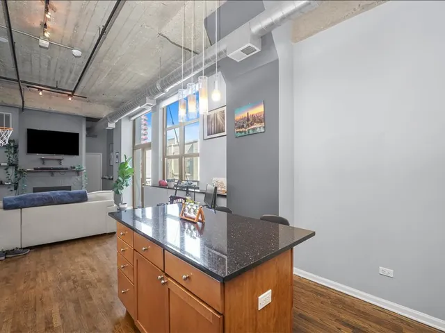 a kitchen with a counter space a sink and appliances