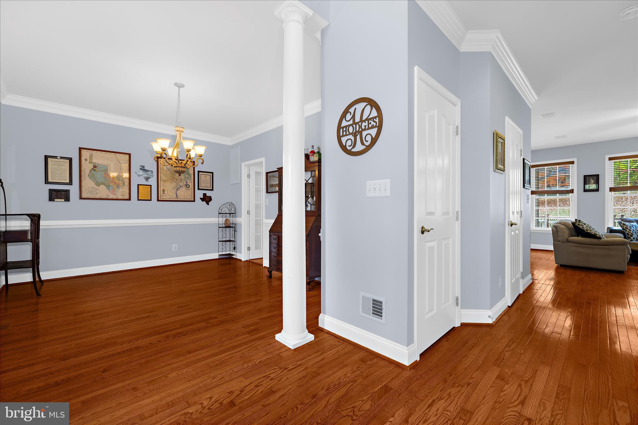 211 Still Water Lane Huntingtown, MD 20639 - Photo 14 of 87 a view of a hallway with wooden floor and workspace