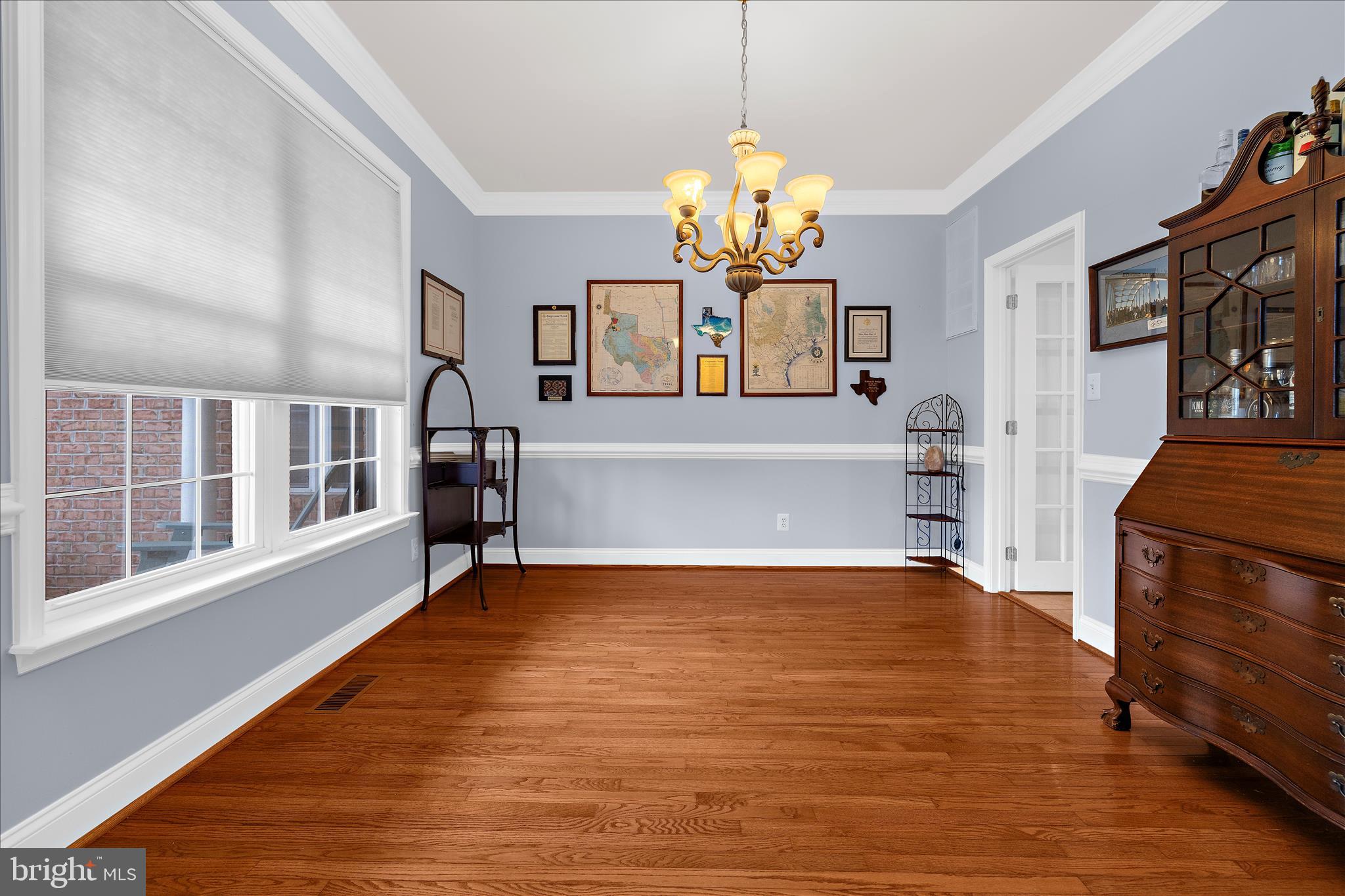211 Still Water Lane Huntingtown, MD 20639 - Photo 18 of 87 a view of an empty room with a window and wooden floor