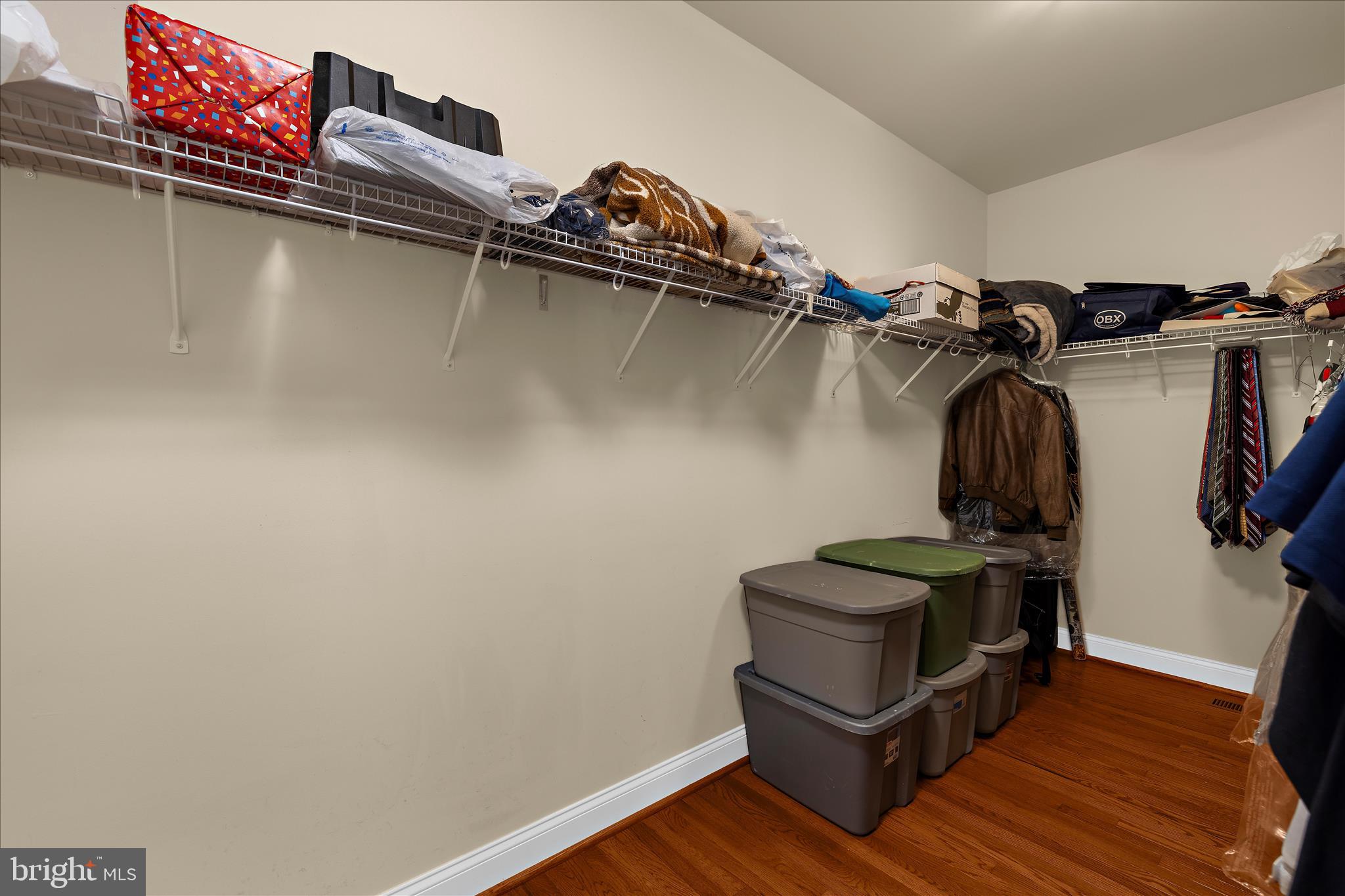 211 Still Water Lane Huntingtown, MD 20639 - Photo 31 of 87 a view of walk in closet with clothes and shoes
