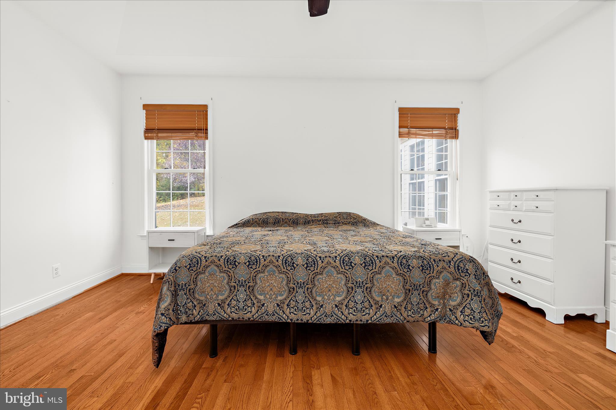 211 Still Water Lane Huntingtown, MD 20639 - Photo 32 of 87 a bedroom with a bed and a window