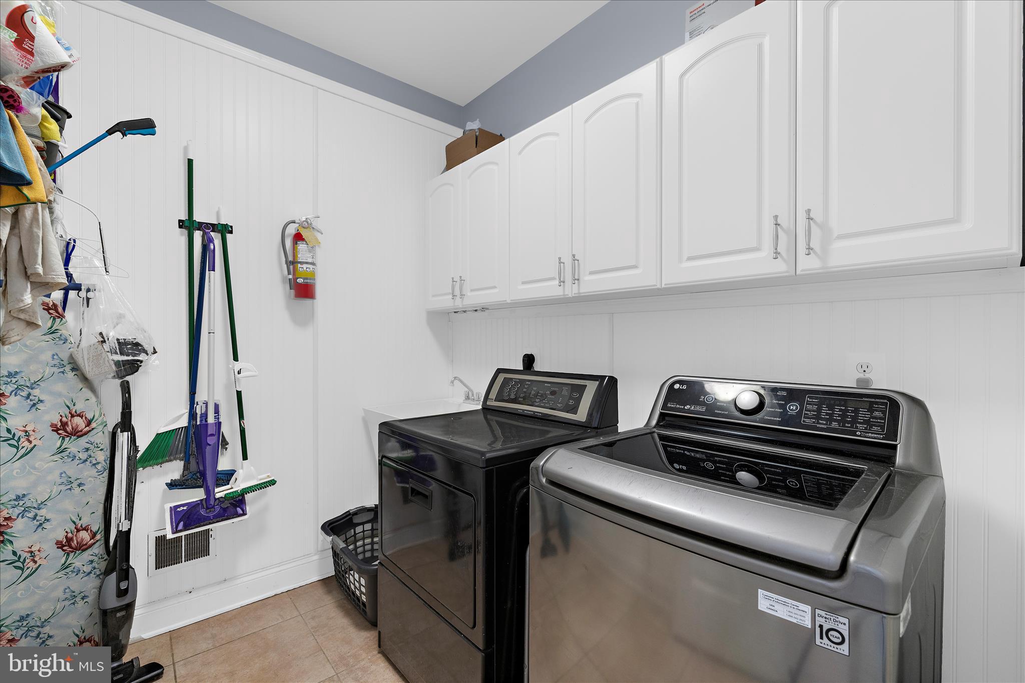 211 Still Water Lane Huntingtown, MD 20639 - Photo 40 of 87 a view of storage and utility room with washer and dryer