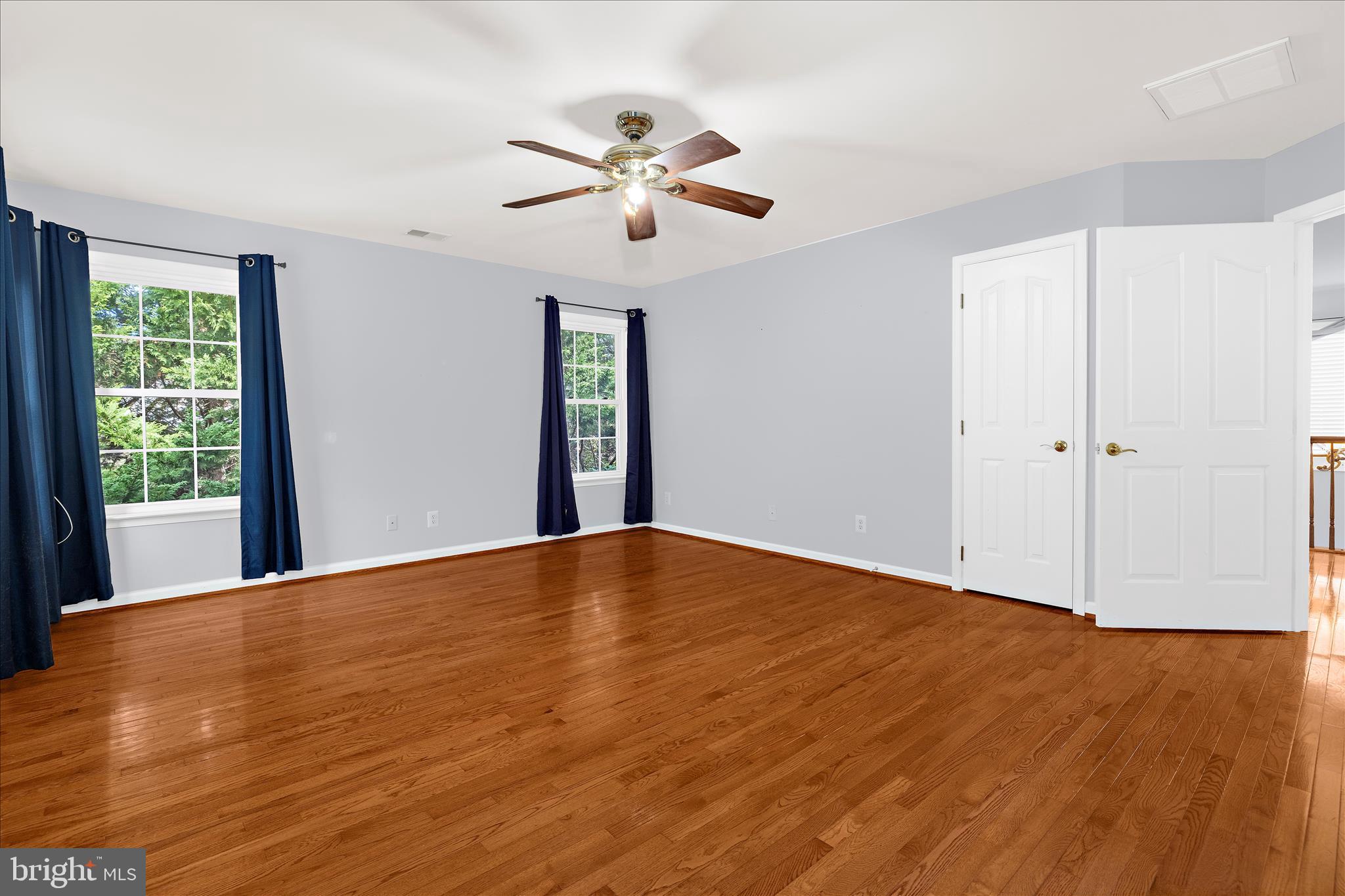 211 Still Water Lane Huntingtown, MD 20639 - Photo 44 of 87 a view of an empty room with wooden floor and a window