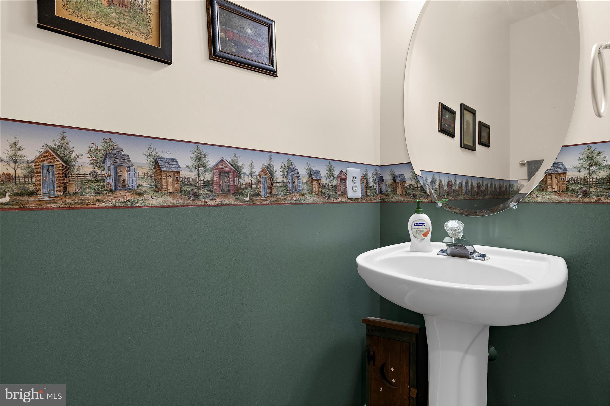 211 Still Water Lane Huntingtown, MD 20639 - Photo 54 of 87 a bathroom with a sink and a mirror