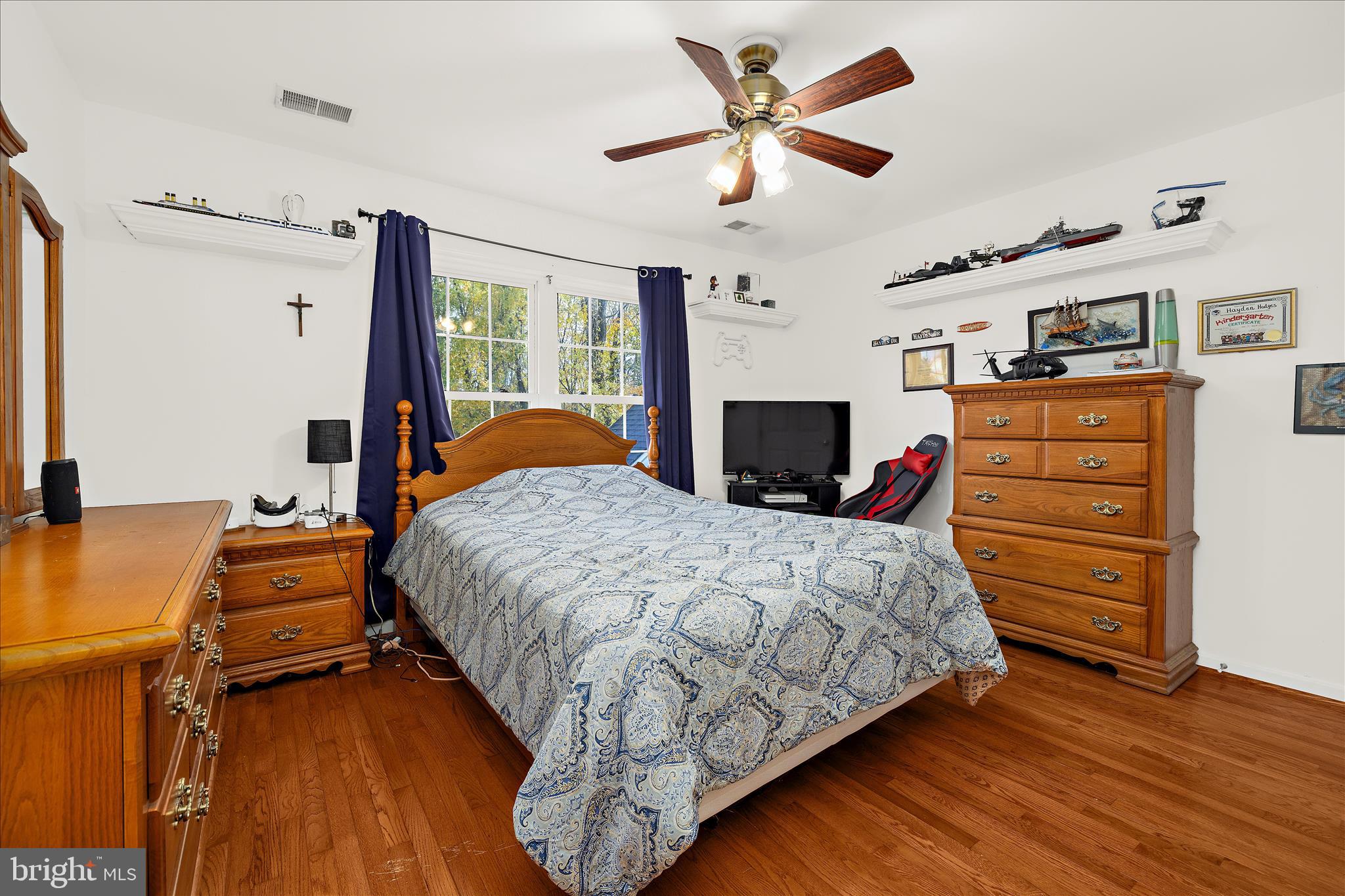 211 Still Water Lane Huntingtown, MD 20639 - Photo 59 of 87 a bedroom with bed and wooden floor