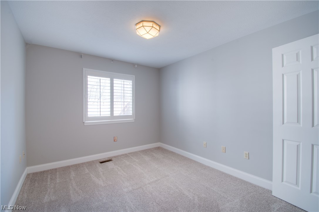 105 Furnace Run Road, Unit 105 Akron, OH 44307 - Photo 15 of 22 Second bedroom on the main floor.