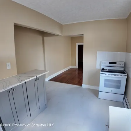 a view of kitchen and wooden floor