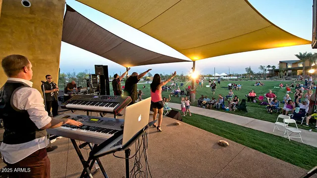 a view of a chairs and table in patio with a fire pit