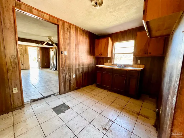a view of a bathroom with tub and shower
