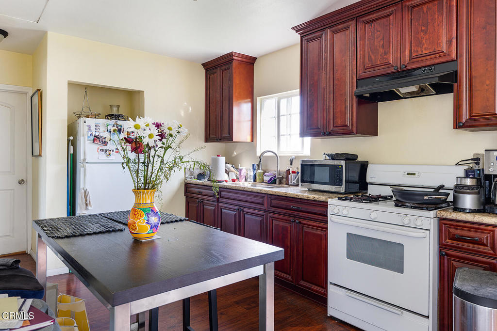 2734 West Ramona Road Alhambra, CA 91803 - Photo 12 of 18 a kitchen with stainless steel appliances granite countertop a sink a stove a refrigerator and cabinets