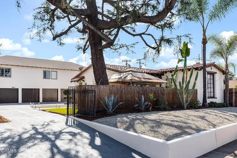 a view of swimming pool with palm trees