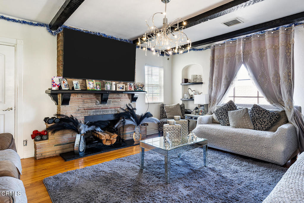 2734 West Ramona Road Alhambra, CA 91803 - Photo 10 of 18 a living room with furniture a flat screen tv and a window