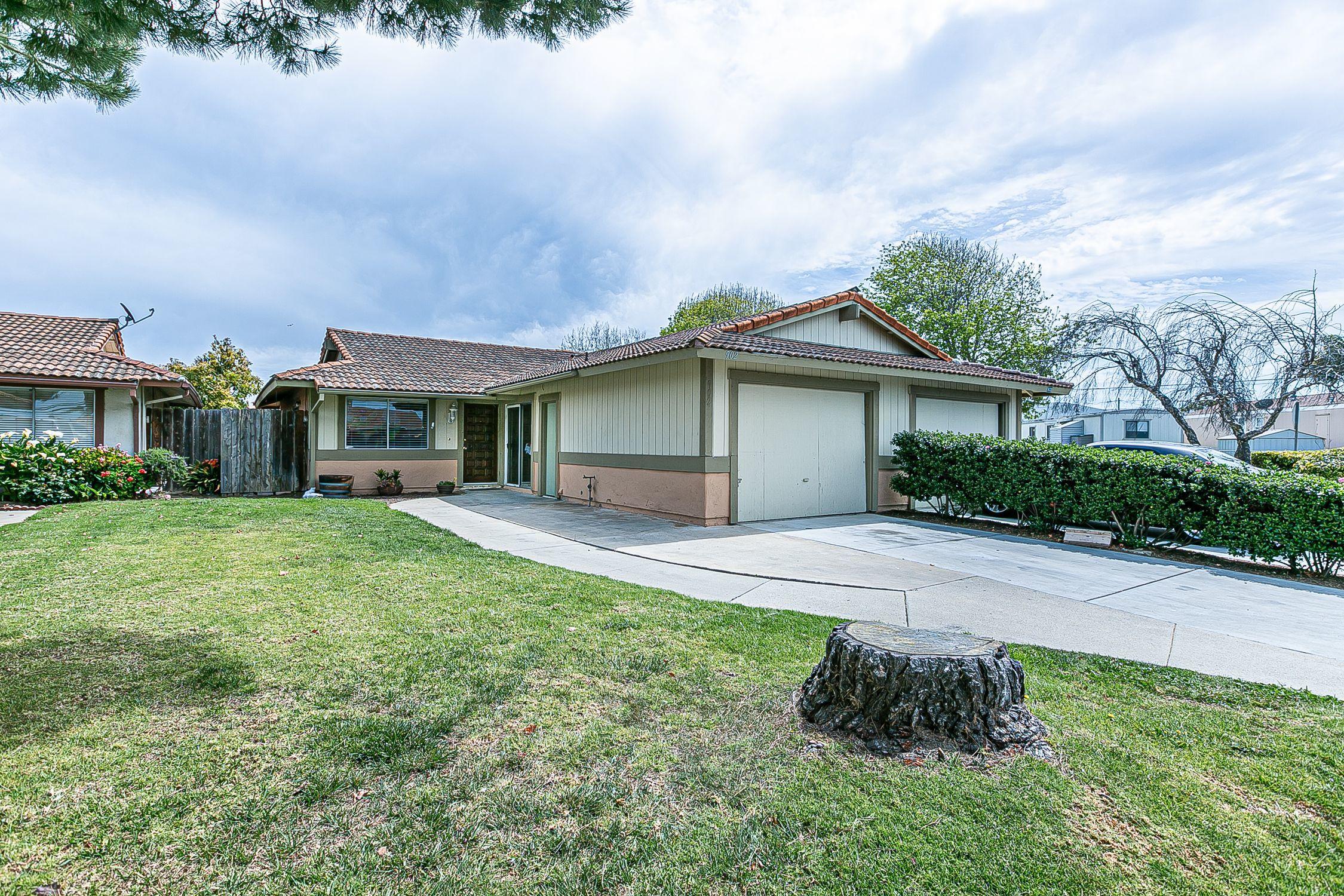 902 North O Street Lompoc, CA 93436 - Photo 1 of 25 a front view of a house with a garden