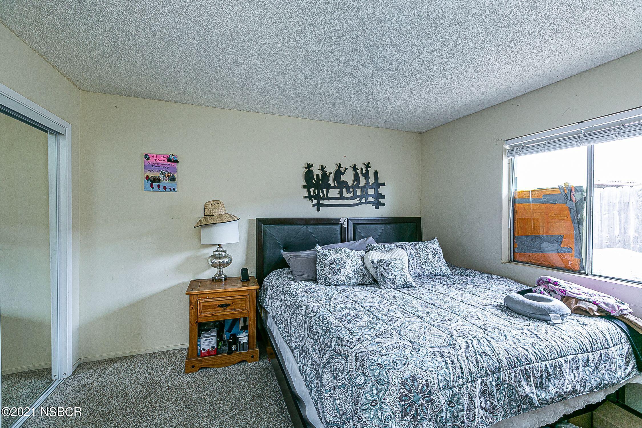 902 North O Street Lompoc, CA 93436 - Photo 16 of 25 a bedroom with a bed and a window