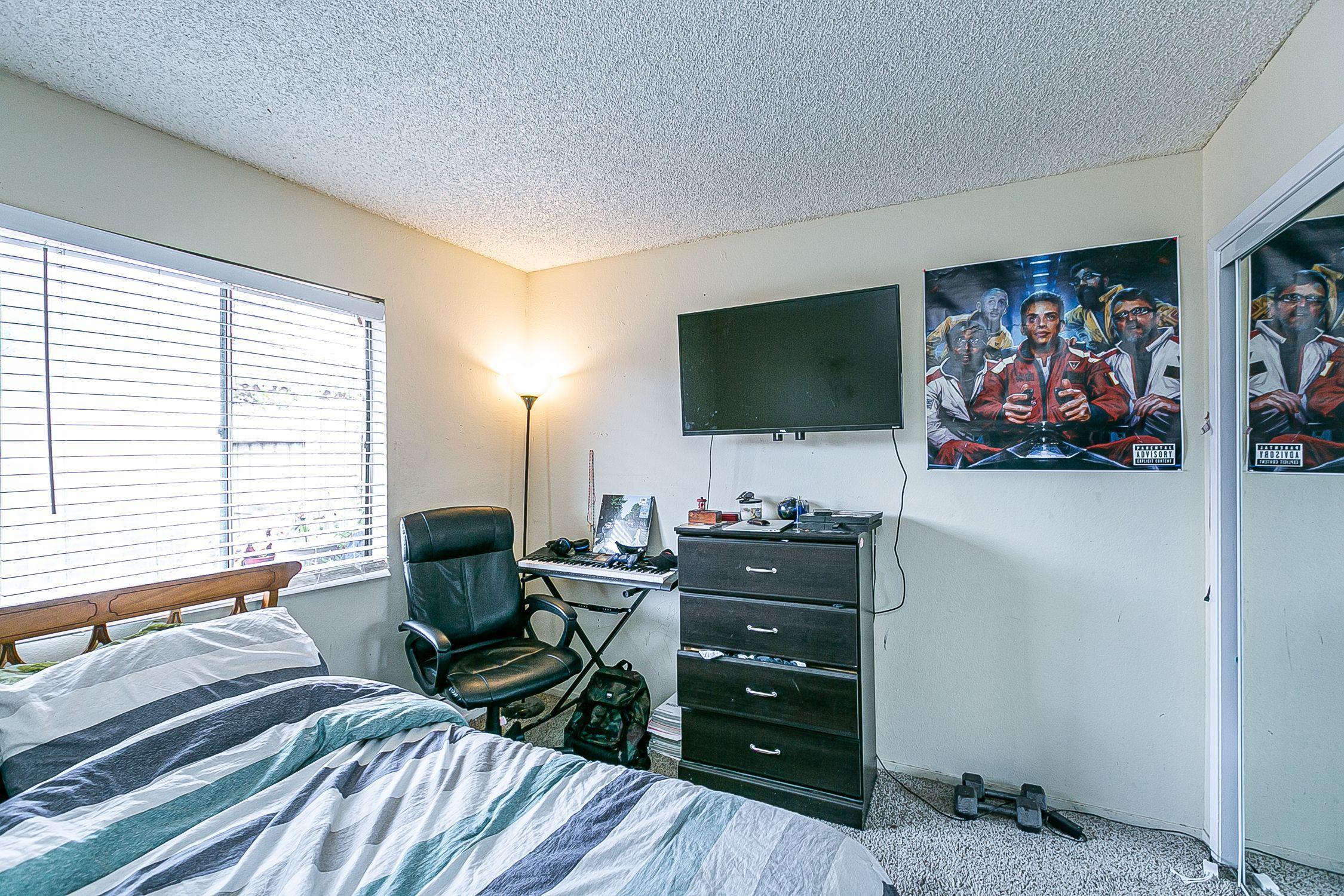 902 North O Street Lompoc, CA 93436 - Photo 18 of 25 a living room with furniture and a flat screen tv