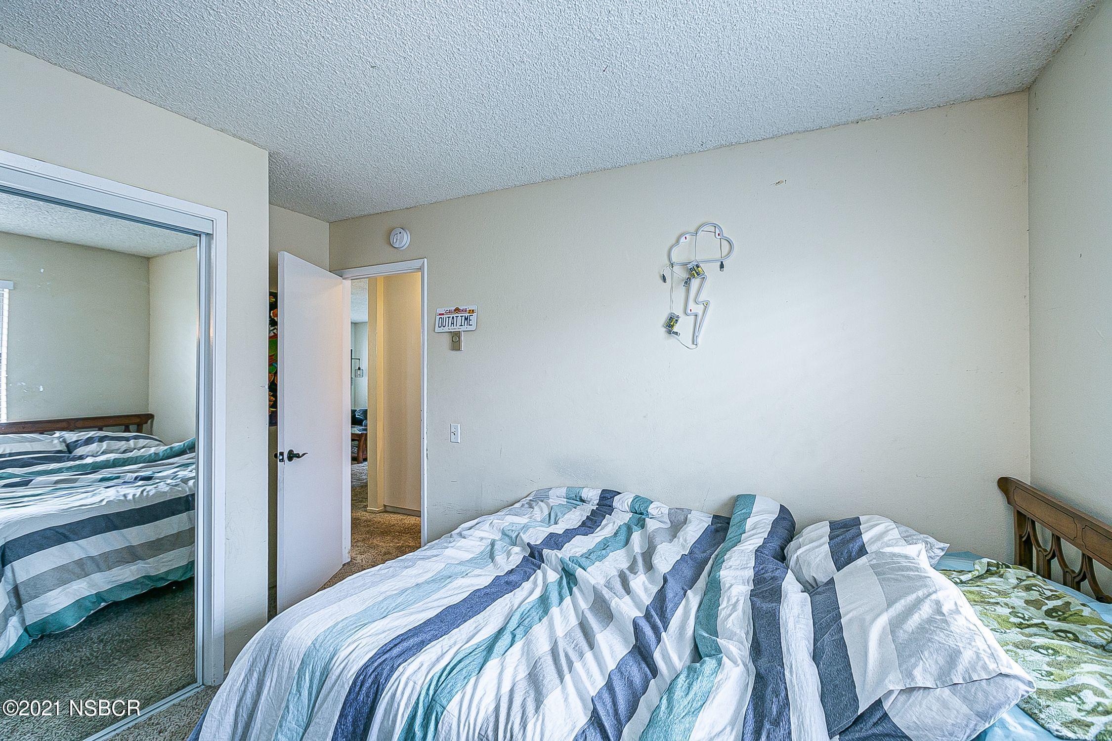 902 North O Street Lompoc, CA 93436 - Photo 19 of 25 a bedroom with a bed and with view of bedroom