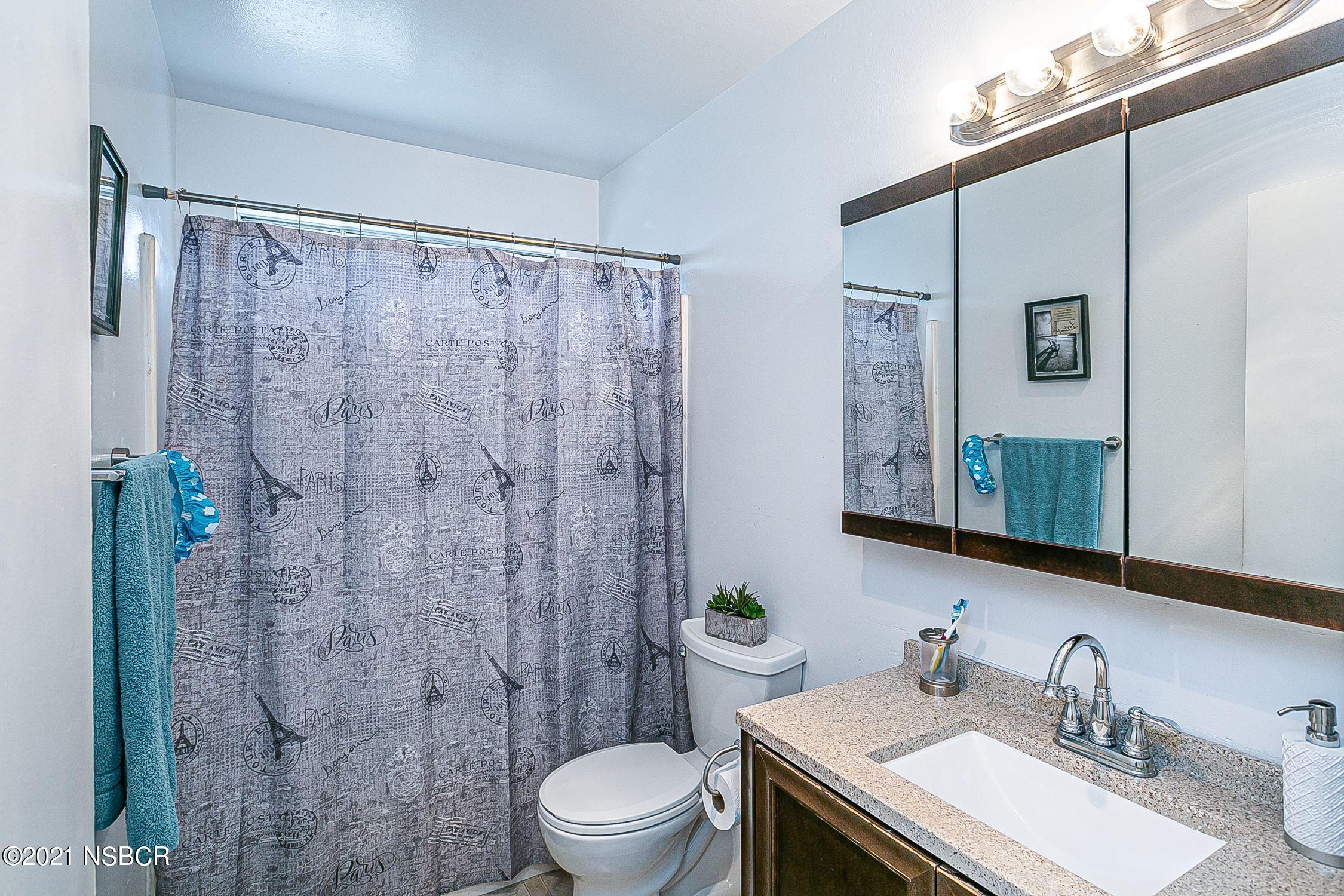 902 North O Street Lompoc, CA 93436 - Photo 20 of 25 a bathroom with a sink a toilet and shower