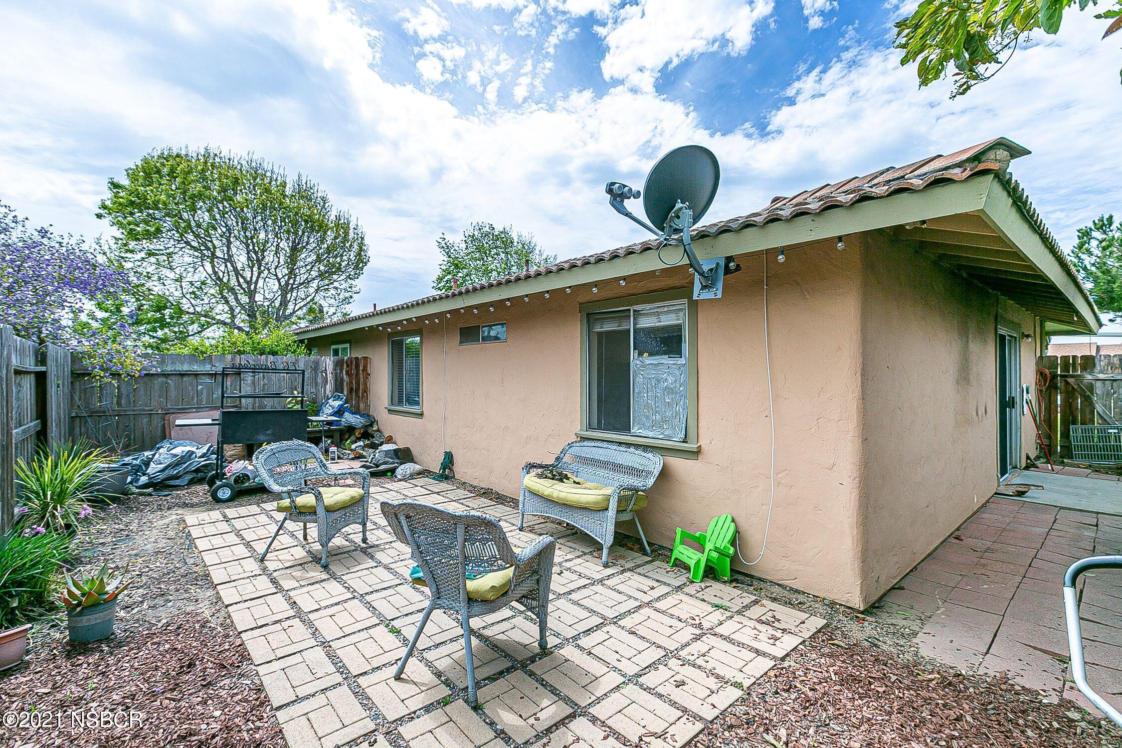 902 North O Street Lompoc, CA 93436 - Photo 23 of 25 a backyard of a house with outdoor seating