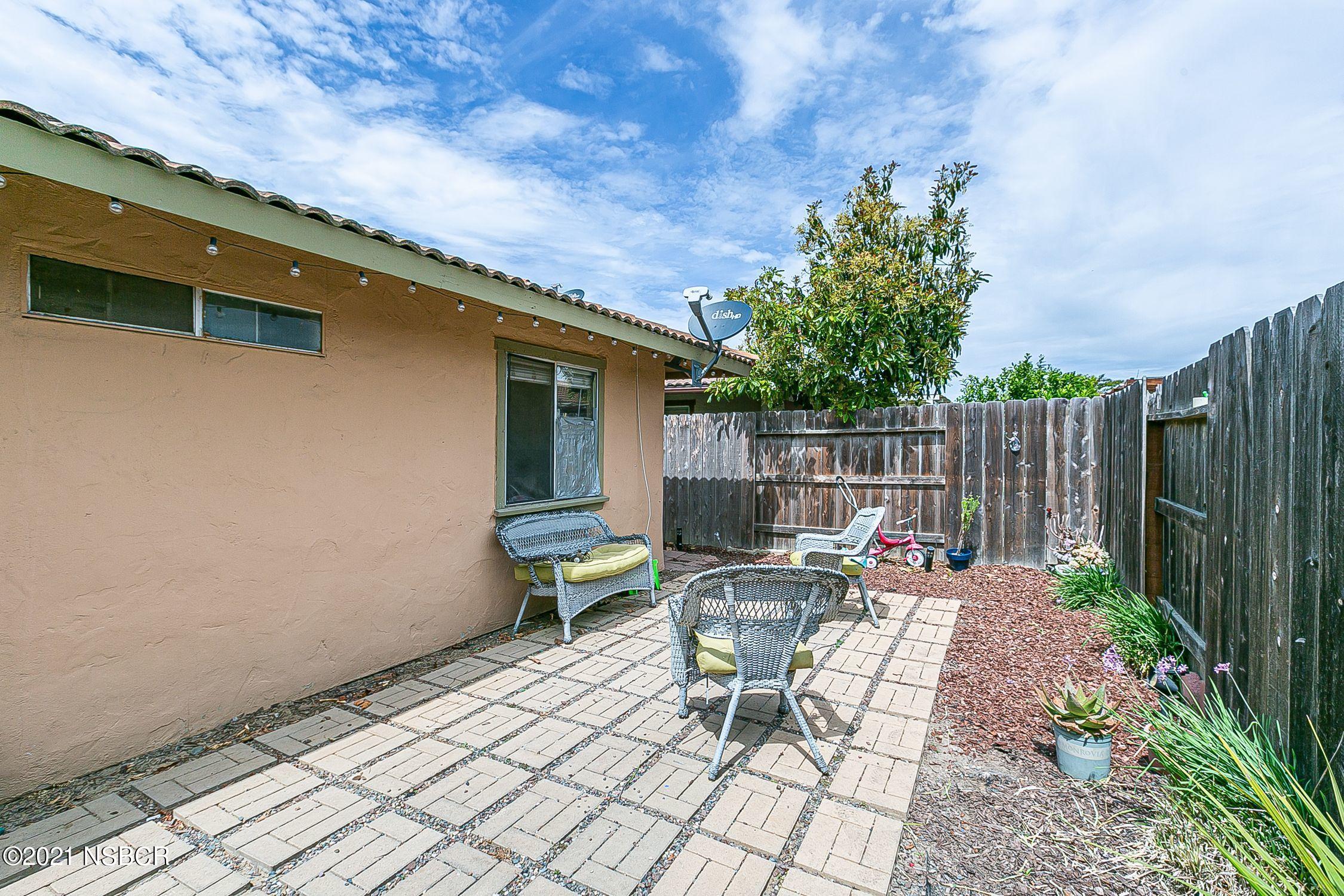 902 North O Street Lompoc, CA 93436 - Photo 24 of 25 a view of backyard with outdoor seating and green space
