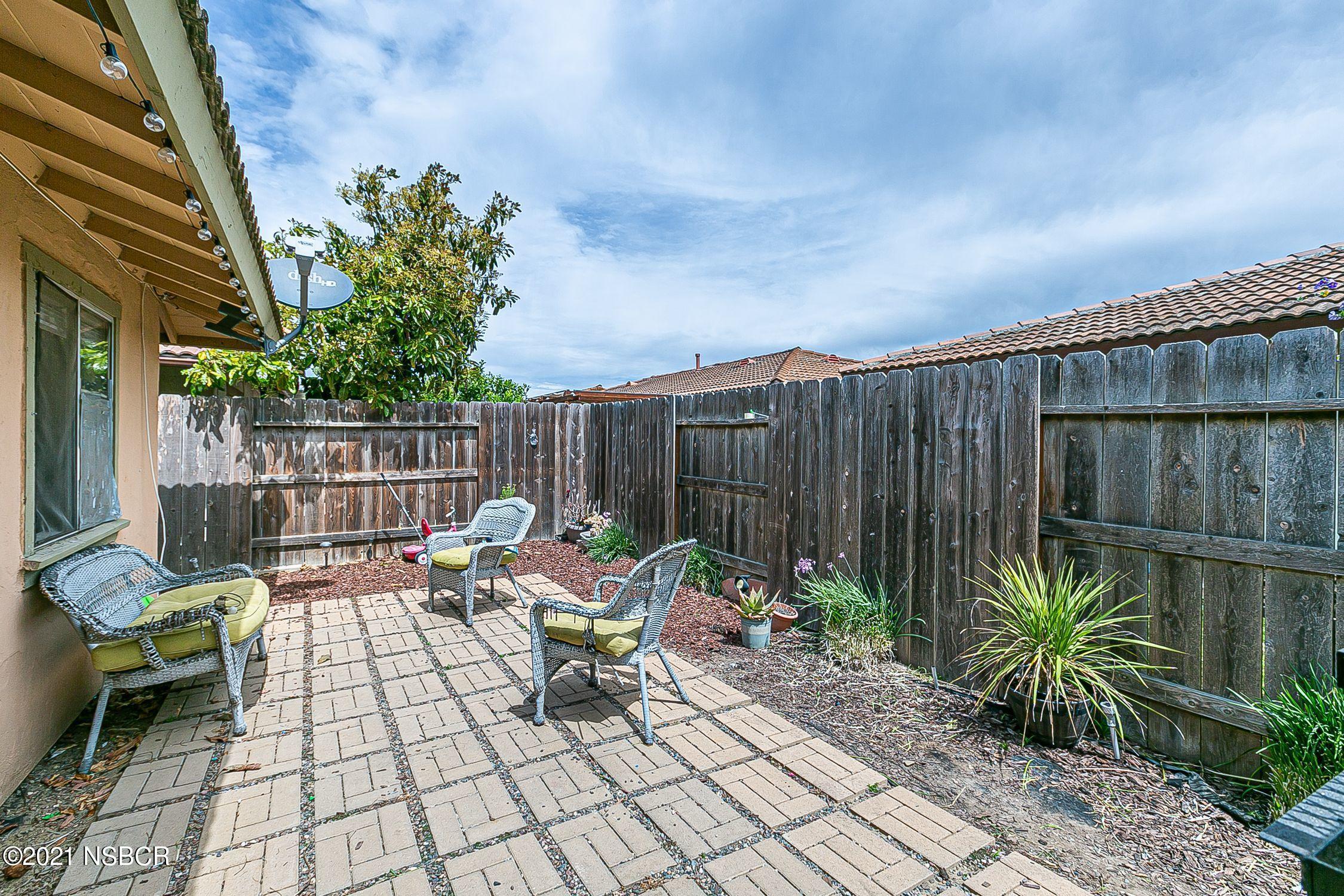 902 North O Street Lompoc, CA 93436 - Photo 25 of 25 a backyard of a house with table and chairs