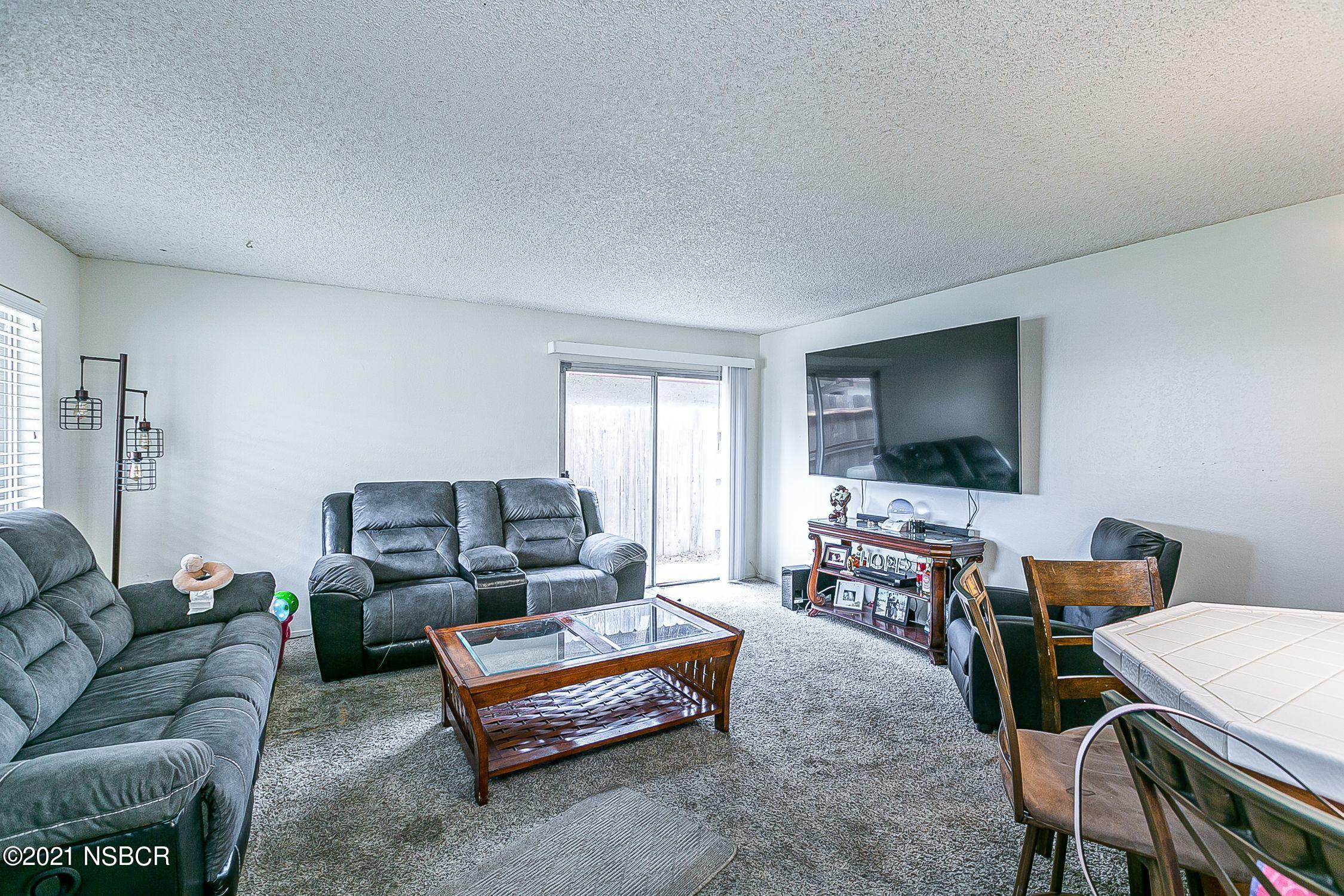 902 North O Street Lompoc, CA 93436 - Photo 5 of 25 a living room with furniture and a flat screen tv