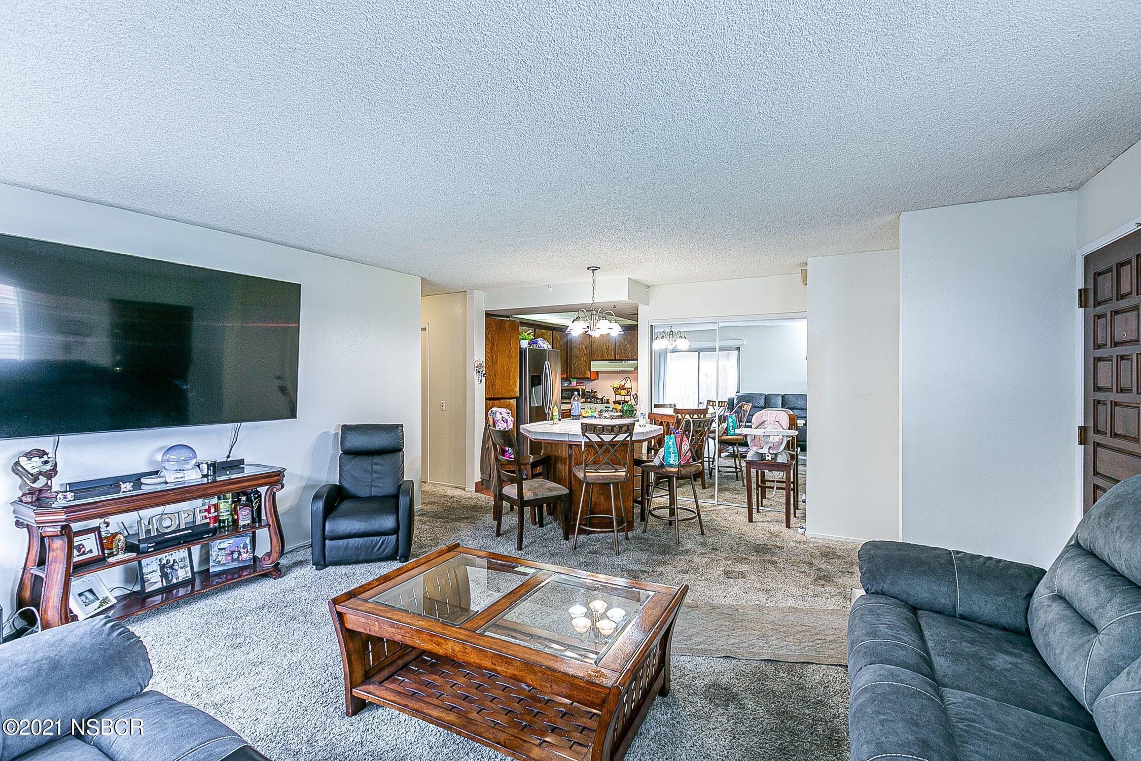 902 North O Street Lompoc, CA 93436 - Photo 6 of 25 a living room with furniture and a flat screen tv