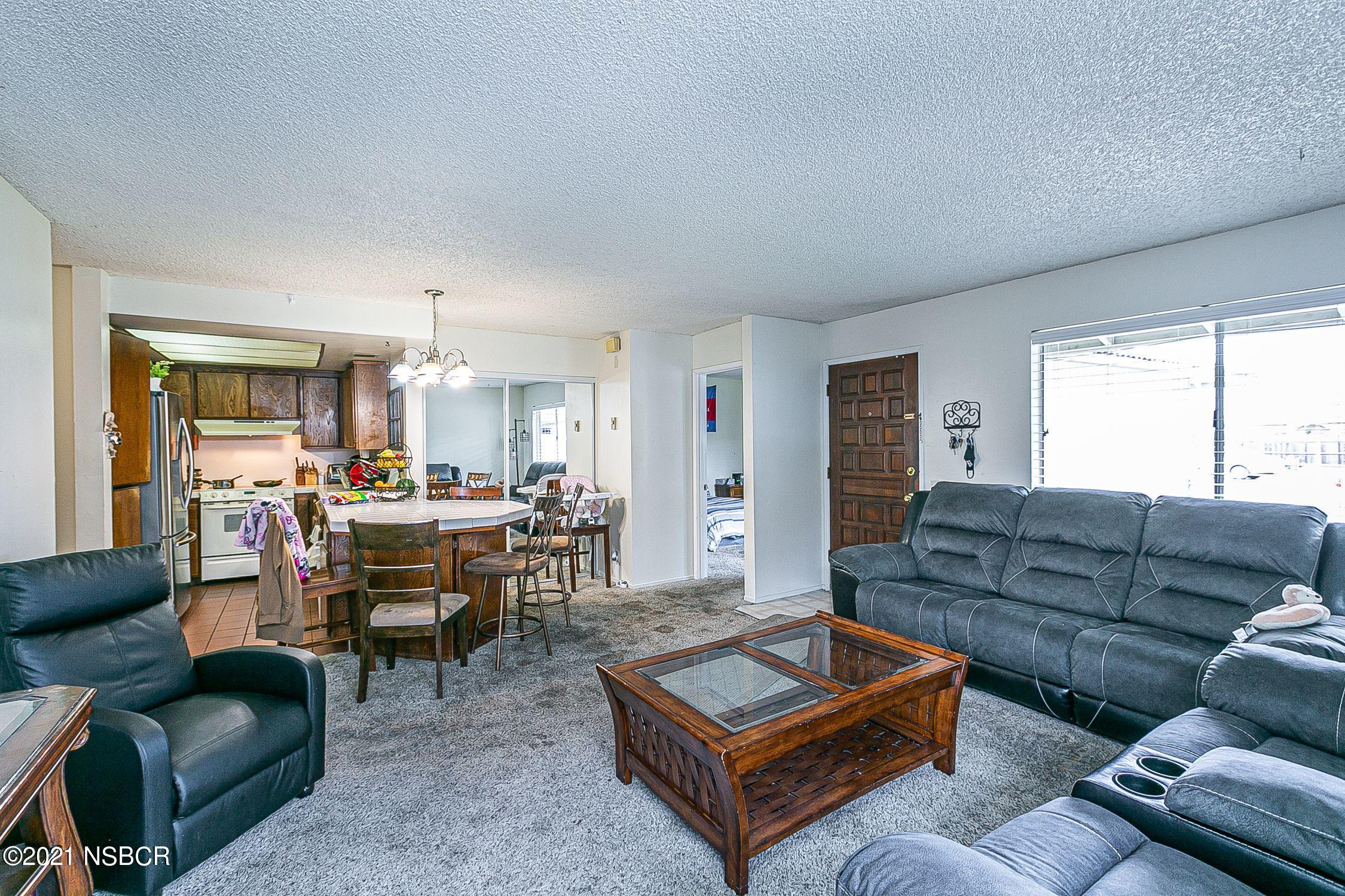 902 North O Street Lompoc, CA 93436 - Photo 7 of 25 a living room with furniture kitchen view and a large window