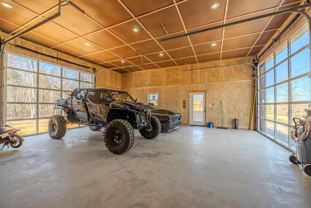 a view of a garage with a car parked