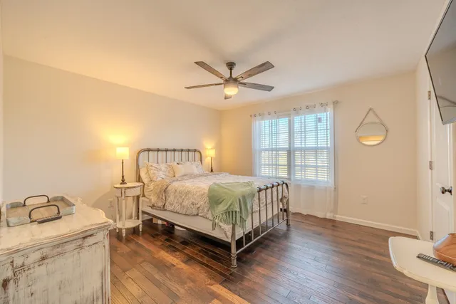 a bedroom with a bed and window