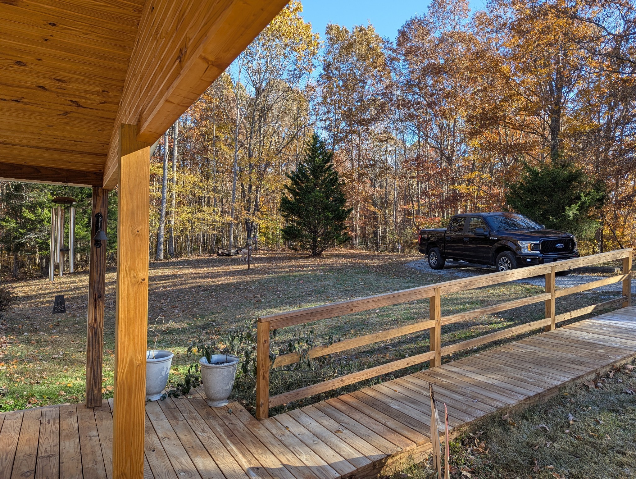 1423 Pack Road White Bluff, TN 37187 - Photo 40 of 50 a view of backyard with wooden floor and outdoor seating