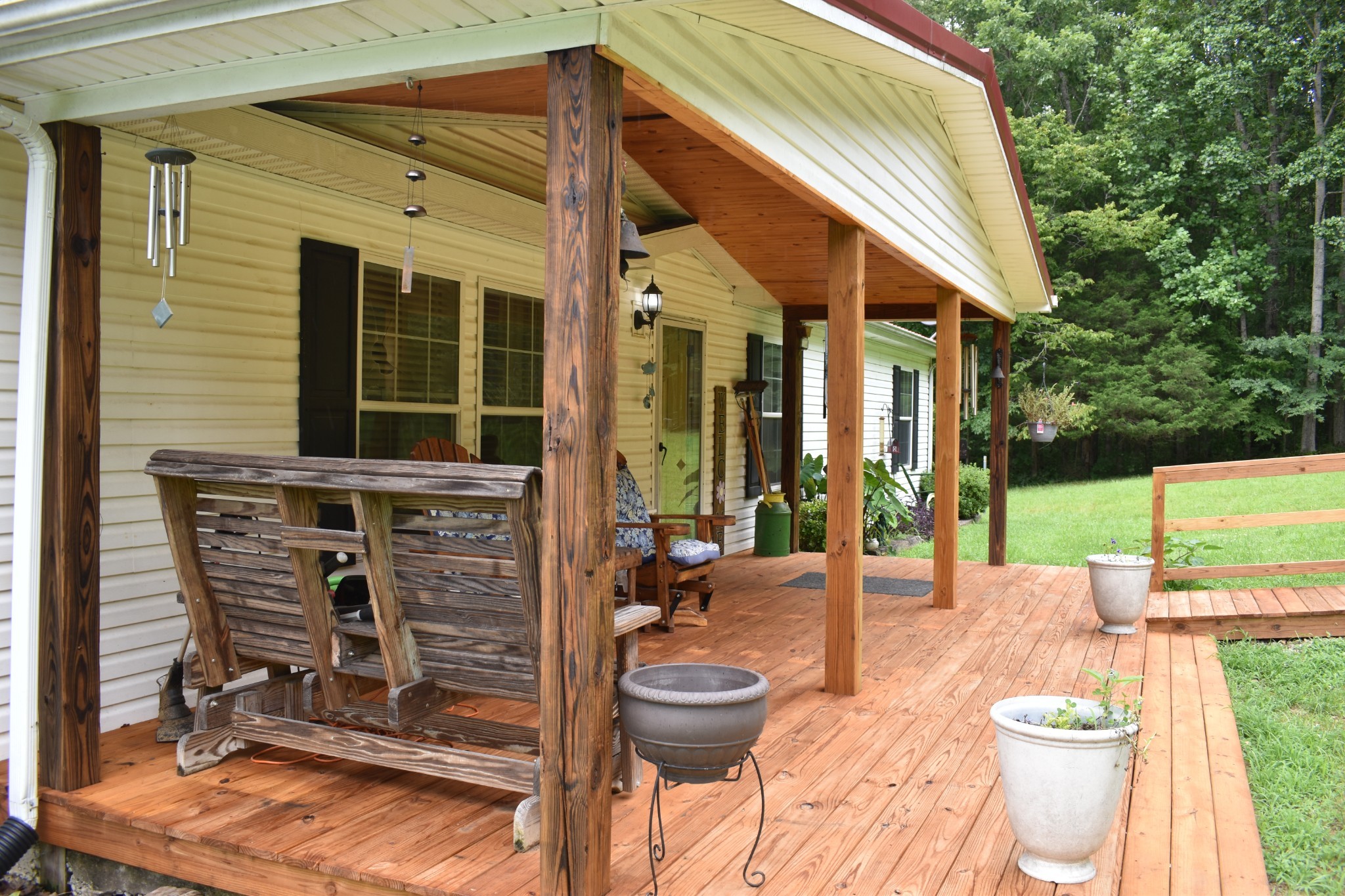 1423 Pack Road White Bluff, TN 37187 - Photo 6 of 50 a view of a patio with table and chairs next to yard