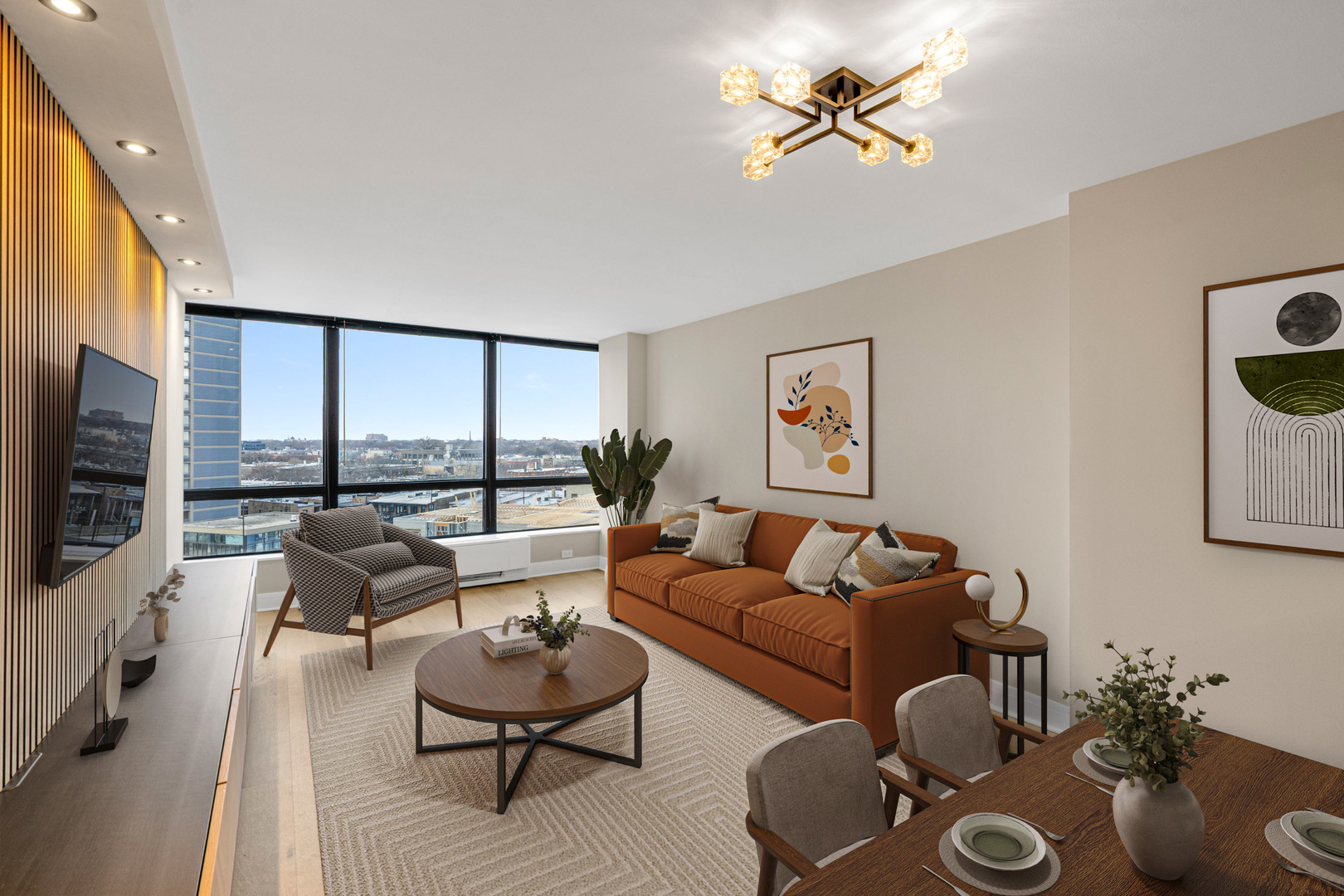5415 North Sheridan Road, Unit 915 Chicago, IL 60640 - Photo 2 of 28 a living room with furniture a flat screen tv and a large window