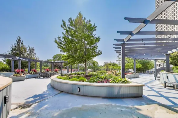 a view of a swimming pool with a outdoor seating