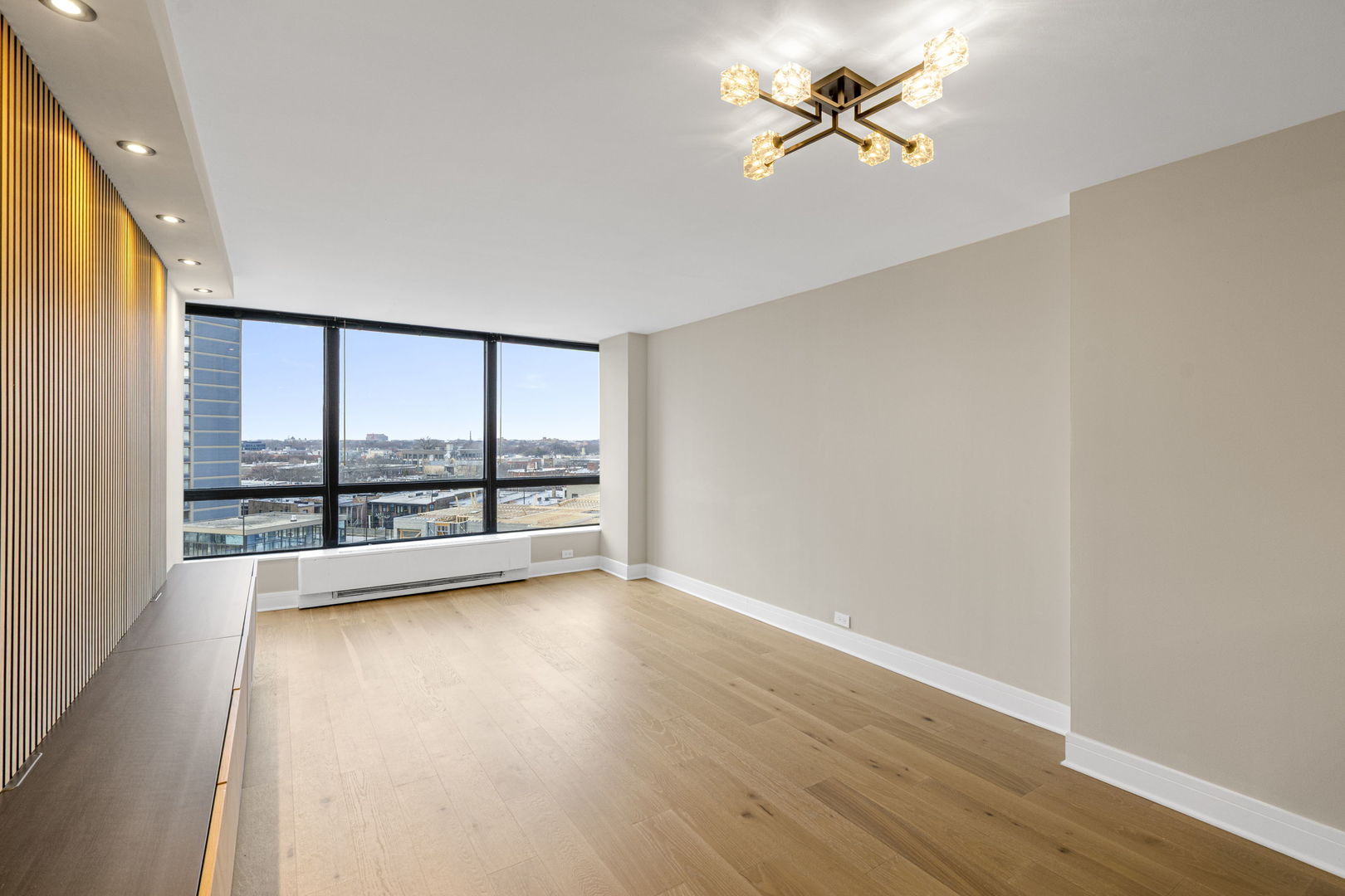 5415 North Sheridan Road, Unit 915 Chicago, IL 60640 - Photo 3 of 28 wooden floor in an empty room with a window
