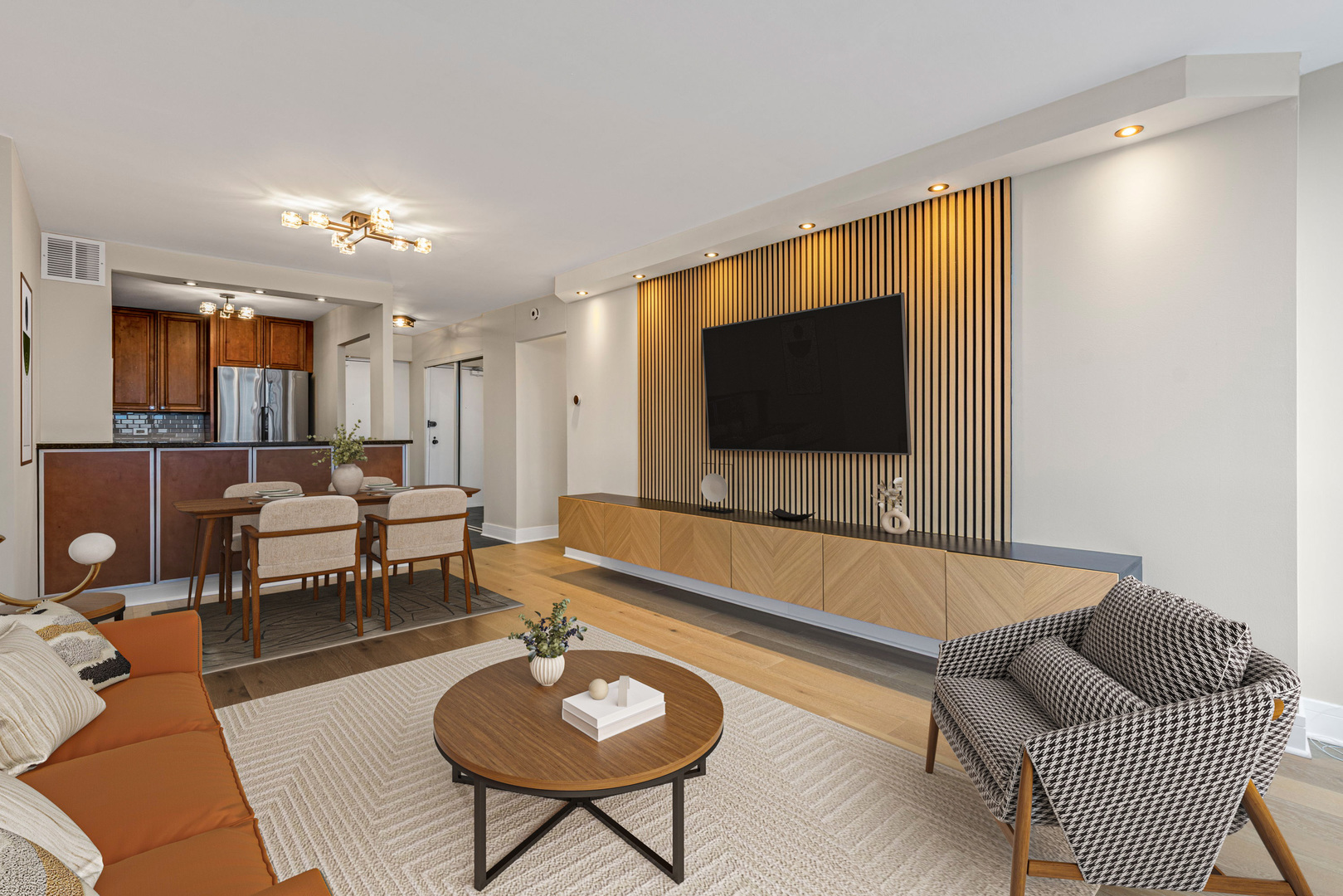 5415 North Sheridan Road, Unit 915 Chicago, IL 60640 - Photo 4 of 28 a living room with furniture and a flat screen tv