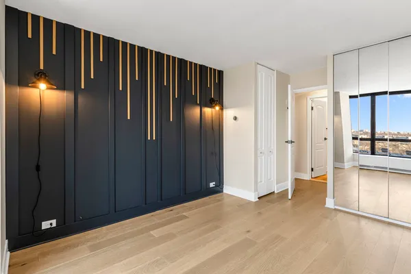 a view of a elevator with wooden floor