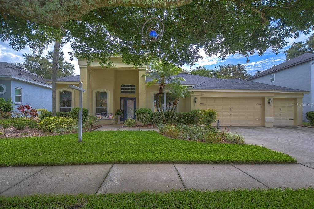1111 Split Silk Street Valrico, FL 33594 - Photo 1 of 1 a front view of a house with a yard and garage