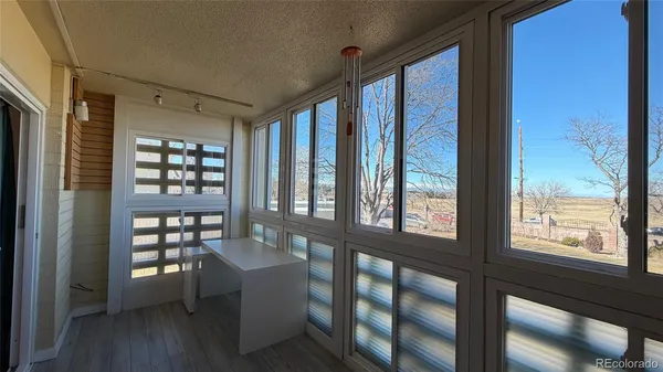 a view of a living room and hardwood floor