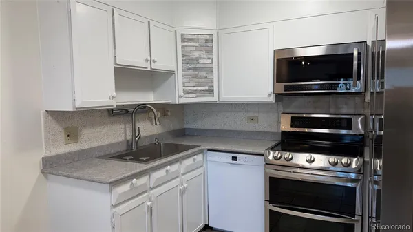a kitchen with a stove and a microwave