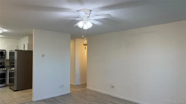 a view of a livingroom with a chandelier fan