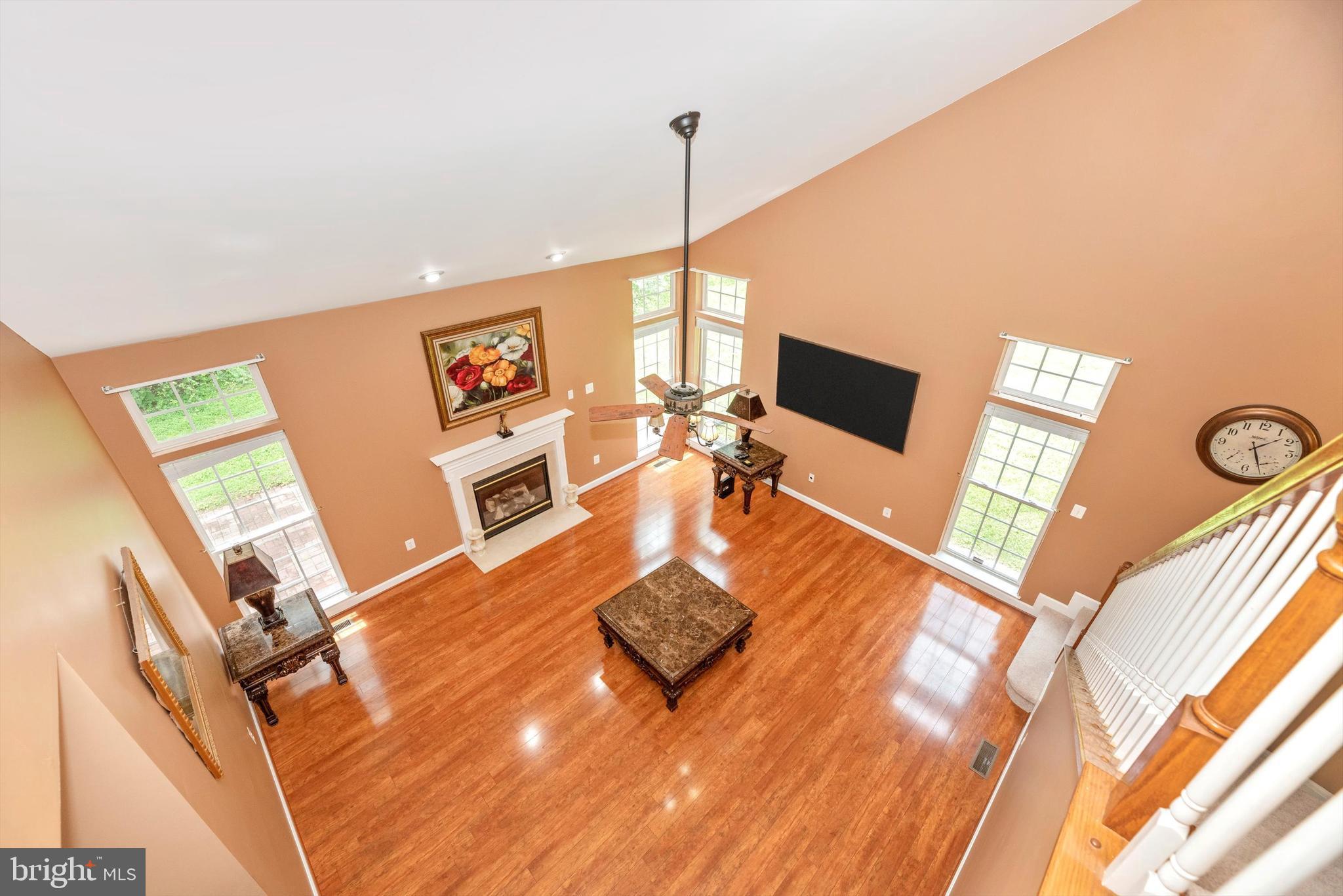 6636 South Clifton Road Frederick, MD 21703 - Photo 28 of 81 a living room with furniture a flat screen tv and a window