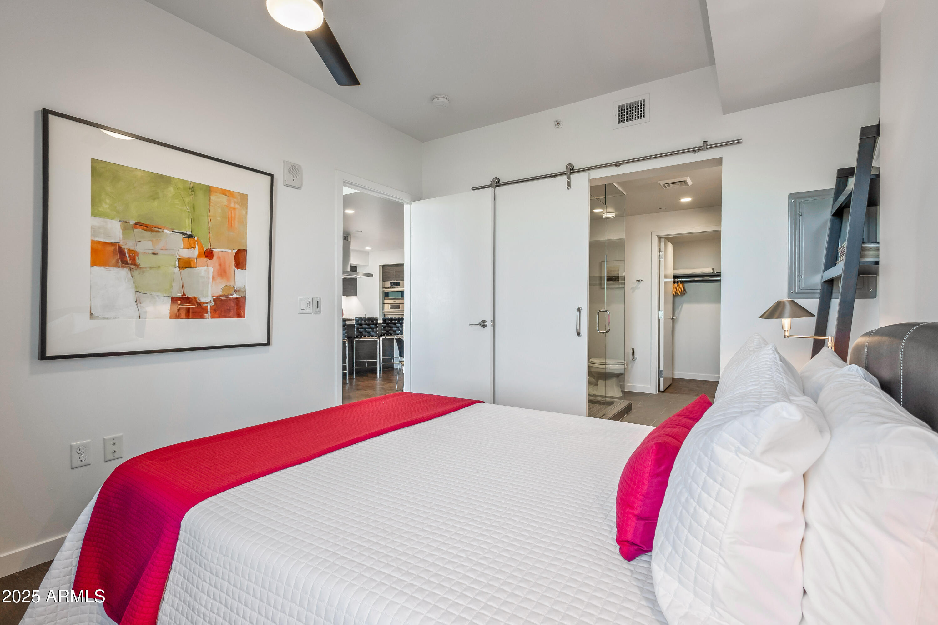 200 West Portland Street, Unit 1024 Phoenix, AZ 85003 - Photo 11 of 48 a bed room with a bed and a painting on the wall