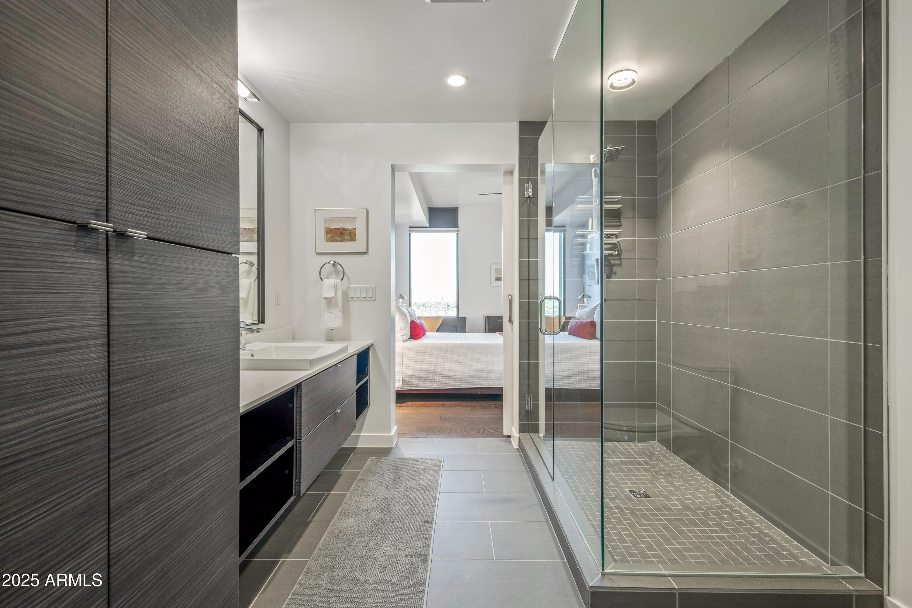 200 West Portland Street, Unit 1024 Phoenix, AZ 85003 - Photo 37 of 48 a bathroom with a sink a toilet and shower