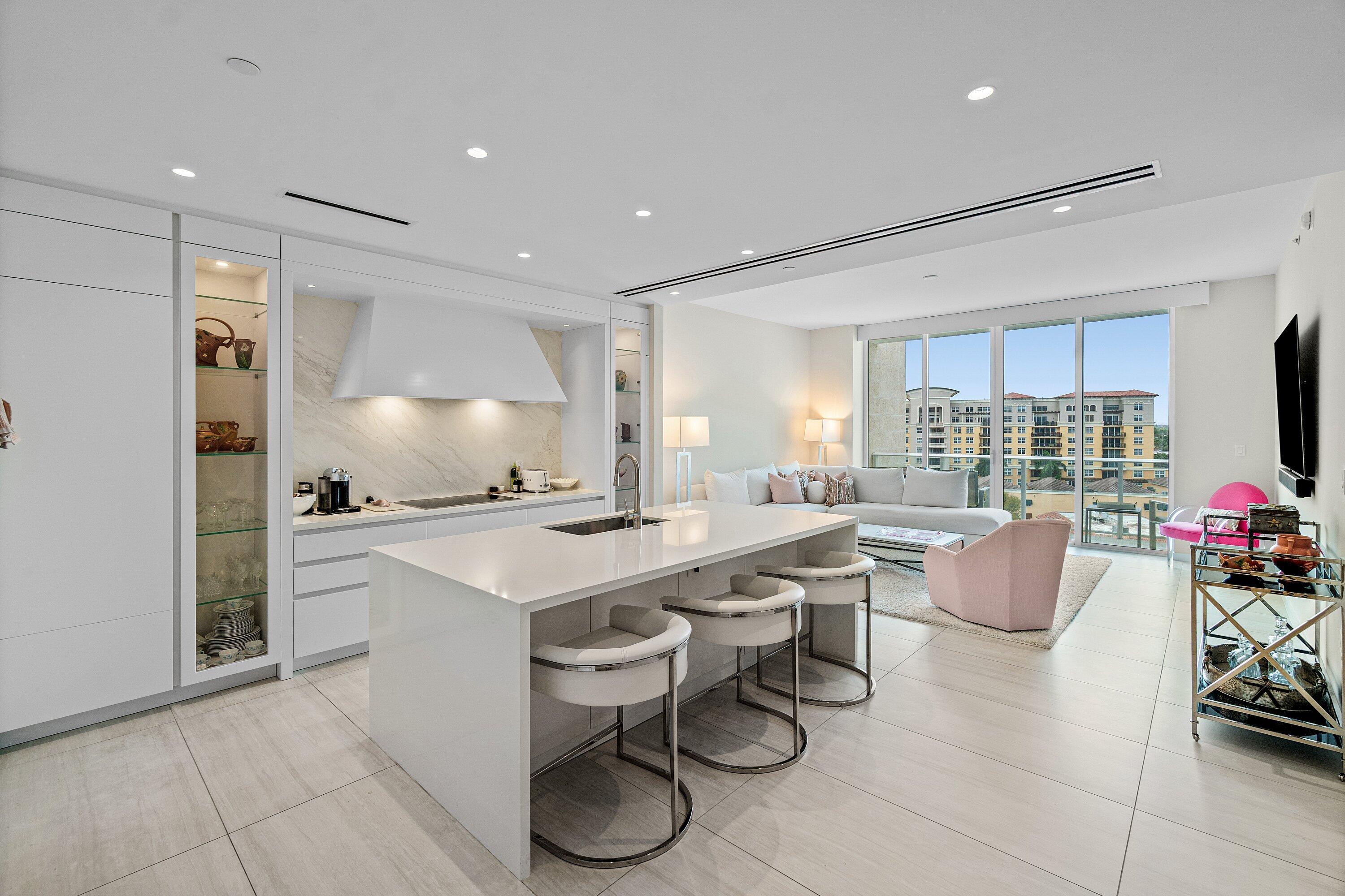 200 Southeast Mizner Boulevard, Unit 810 Boca Raton, FL 33432 - Photo 7 of 29 a kitchen with a sink and a refrigerator