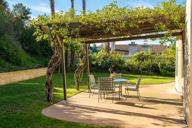 a view of a swimming pool with a patio